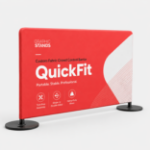 QuickFit custom fabric crowd control barrier with red branded graphic and two round bases